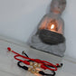 Pulsera tejida en oro laminado