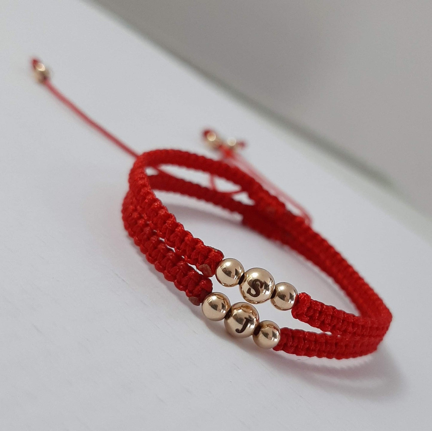Pulsera tejida en oro laminado