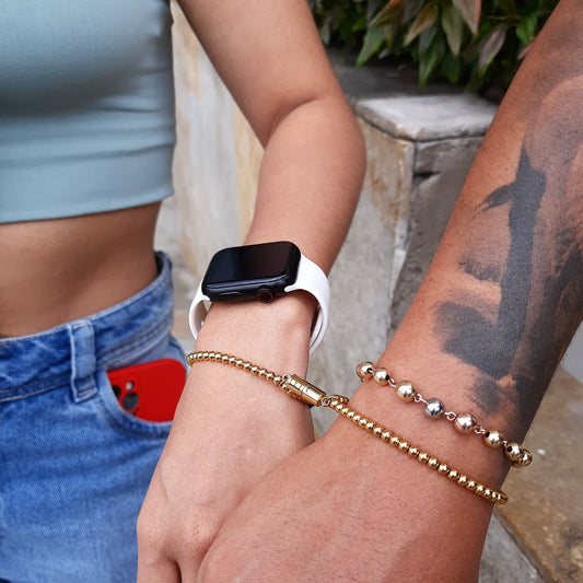 Pulseras conexión doradas